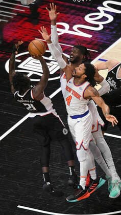 LOS ANGELES, CA - MAY 09: Rajon Rondo (4) of the LA Clippers has a shot blocked by Reggie Bullock (25) and Derrick Rose (4) of the New York Knicks in the first half during the Los Angeles Clippers versus New York Knicks at on May 9, 2021, at Staples Center in Los Angeles, CA. (Photo by John McCoy Icon Sportswire) NBA, Basketball Herren, USA MAY 09 Knicks at Clippers Icon2105090013