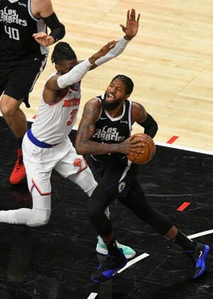 LOS ANGELES, CA - MAY 09: Paul George (13) of the LA Clippers drives into Nerlens Noel (3) of the New York Knicks in the first half during the Los Angeles Clippers versus New York Knicks at on May 9, 2021, at Staples Center in Los Angeles, CA. (Photo by John McCoy Icon Sportswire) NBA, Basketball Herren, USA MAY 09 Knicks at Clippers Icon210509009