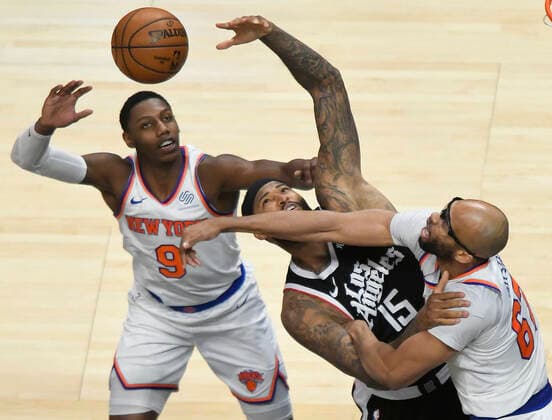 LOS ANGELES, CA - MAY 09: DeMarcus Cousins (15) of the LA Clippers has a shot blocked by Taj Gibson (67) as RJ Barrett (9) of the New York Knicks looks on in the second half during the Los Angeles Clippers versus New York Knicks at on May 9, 2021, at Staples Center in Los Angeles, CA. (Photo by John McCoy Icon Sportswire) NBA, Basketball Herren, USA MAY 09 Knicks at Clippers Icon2105090026