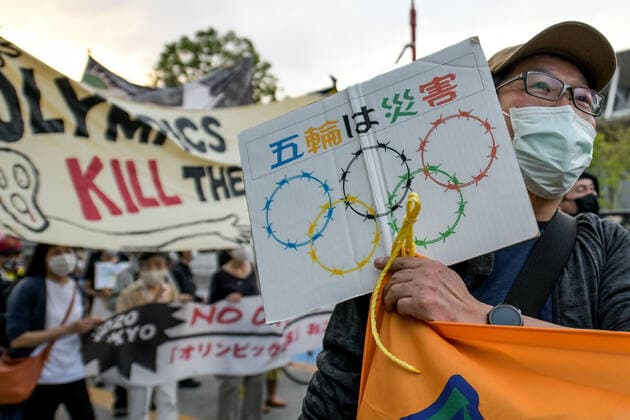 May 9, 2021, Tokyo, Japan: Protesters carry banners and placards as they demonstrate against the Tokyo Olympics in front of the New National Stadium, the main stadium for the Tokyo Olympics..With less than 3 months remaining until the opening of the Tokyo 2020 Olympics concern continues to linger in Japan over the feasibility of hosting such a huge event during the ongoing COVID-19 pandemic. Tokyo Japan - ZUMAs197 0117369337st Copyright: xCezaryxKowalskix