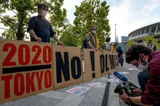 May 9, 2021, Tokyo, Japan: Protesters hold a big banner as they demonstrate against the Tokyo Olympics in front of the New National Stadium, the main stadium for the Tokyo Olympics..With less than 3 months remaining until the opening of the Tokyo 2020 Olympics concern continues to linger in Japan over the feasibility of hosting such a huge event during the ongoing COVID-19 pandemic. Tokyo Japan - ZUMAs197 0117369353st Copyright: xCezaryxKowalskix