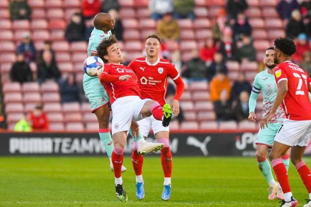Barnsley v Swansea City EFL Sky Bet Championship 17 05 2021. Play-Off First Leg Barnsley midfielder Callum Styles (4) wrestles with Swansea City forward Andre Ayew (10) during the EFL Sky Bet Championship 1st leg play off match between Barnsley and Swansea City at Oakwell, Barnsley, England on 17 May 2021. Barnsley Oakwell South Yorkshire England Editorial use only DataCo restrictions apply See www.football-dataco.com , Copyright: xMalcolmxBrycex PSI-12778-0016