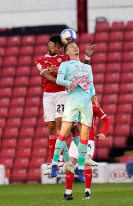 Barnsley, England, 17th May 2021. Romal Palmer of Barnsley with Jay Fulton of Swansea City during the Sky Bet Championship match at Oakwell, Barnsley. Picture credit should read: Andrew Yates Sportimage EDITORIAL USE ONLY. No use with unauthorised audio, video, data, fixture lists, club league logos or live services. Online in-match use limited to 120 images, no video emulation. No use in betting, games or single club league player publications. SPI-1058-0021