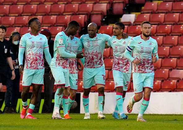 Barnsley, England, 17th May 2021. Andre Ayew of Swansea City celebrates scoring his sides opening goal during the Sky Bet Championship match at Oakwell, Barnsley. Picture credit should read: Andrew Yates Sportimage EDITORIAL USE ONLY. No use with unauthorised audio, video, data, fixture lists, club league logos or live services. Online in-match use limited to 120 images, no video emulation. No use in betting, games or single club league player publications. SPI-1058-0025
