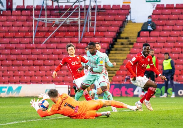 17th May 2021, Oakwell Stadium, Barnsley, Yorkshire, England; English Football League Championship Football, Playoff, Barnsley FC versus Swansea City; Freddie Woodman of Swansea City claims a low cross as Daryl Dike of Barnsley fails to reach the ball  ActionPlus12288689 ChrisxCooper