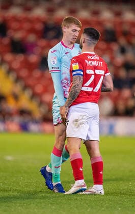 17th May 2021, Oakwell Stadium, Barnsley, Yorkshire, England; English Football League Championship Football, Playoff, Barnsley FC versus Swansea City; Jay Fulton of Swansea City squares up to Alex Mowatt of Barnsley  ActionPlus12288705 ChrisxCooper