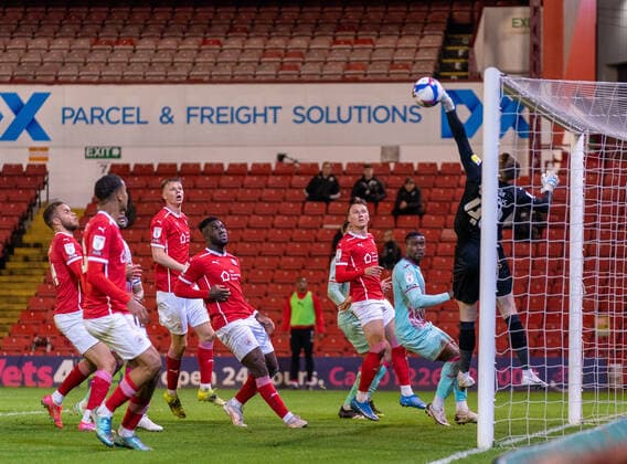 17th May 2021, Oakwell Stadium, Barnsley, Yorkshire, England; English Football League Championship Football, Playoff, Barnsley FC versus Swansea City; Bradley Collins of Barnsley tips the ball away from a Conor Hourihane of Swansea City free kick  ActionPlus12288733 ChrisxCooper