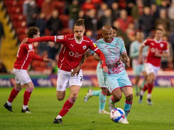 17th May 2021, Oakwell Stadium, Barnsley, Yorkshire, England; English Football League Championship Football, Playoff, Barnsley FC versus Swansea City; Jordan Williams of Barnsley holds off Andr& xe9; Ayew of Swansea City to prevent a counter attack  ActionPlus12288748 ChrisxCooper