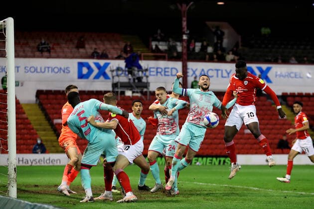 Football - 2020 2021 Sky Bet Championship - Play-offs - Semi-final 1st Leg - Barnsley vs Swansea City - Oakwell Daryl Dike of Barnsley heads at goal 