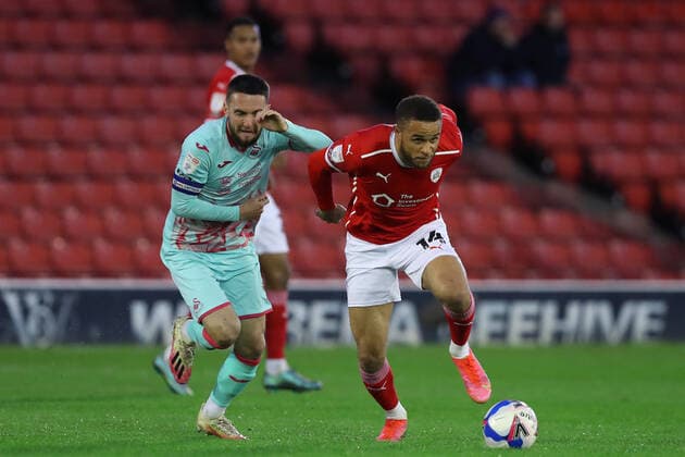Football - 2020 2021 Sky Bet Championship - Play-offs - Semi-final 1st Leg - Barnsley vs Swansea City - Oakwell Matt Grimes of Swansea City and Carlton Morris of Barnsley 