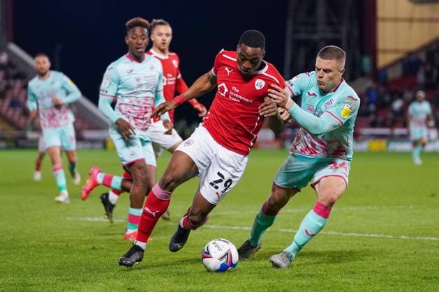 Barnsley v Swansea City EFL Sky Bet Championship 17 05 2021. Play-Off First Leg Barnsley forward Victor Adeboyejo (29) and Swansea City defender Jake Bidwell (24) in action during the EFL Sky Bet Championship 1st leg play off match between Barnsley and Swansea City at Oakwell, Barnsley, England on 17 May 2021. Barnsley Oakwell South Yorkshire England Editorial use only DataCo restrictions apply See www.football-dataco.com , Copyright: xMalcolmxBrycex PSI-12778-0042