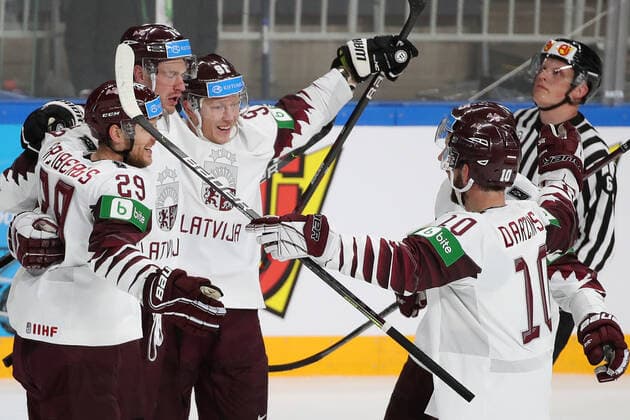RIGA, LATVIA - MAY 21, 2021: Latviaâ€™s players celebrate a goal in their 2021 IIHF World Championship, WM, Weltmeisterschaft Group A Ice hockey, Eishockey match against Canada at Arena Riga. Natalia Fedosenko TASS  TS100E34
