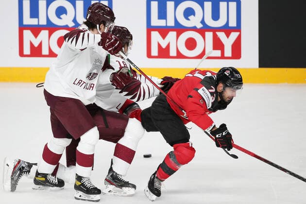 Eishockey, WM, Kanada - Lettland RIGA, LATVIA - MAY 21, 2021: Latvia s Renars Krastenbergs, Rodrigo Abols, Canada s Brandon Pirri (L-R) in action in their 2021 IIHF World Championship, WM, Weltmeisterschaft Group A Ice hockey, Eishockey match at Arena Riga. Natalia Fedosenko TASS  TS100E3D