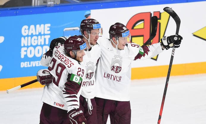 (210522) -- RIGA, May 22, 2021 -- Latvia s Ralfs Freibergs, Miks Indrasis and Ronalds Kenins (L to R) celebrate for scoring during the Group B match between Latvia and Canada at the 2021 IIHF Ice hockey, Eishockey World Championship, WM, Weltmeisterschaft in Riga, Latvia, May 21, 2021. (Photo by Xinhua) (SP)LATVIA-RIGA-ICE HOCKEY-WORLD CHAMPIONSHIP-LATVIA VS CANADA EdijsxPalens 