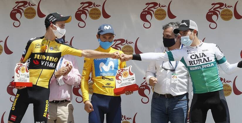 Colombian cyclist Miguel Angel aka Superman Lopez (2L), Movistar, celebrates his overall victory with second classified Antwan Tolhek (L), Jumbo Visma, and third classified Julen Amezqueta Moreno (R), Caja Rural-Seguros RGA, after the final stage of the cycling Vuelta in Almeria, Spain, 22 March 2021. Last stage of the Andalucia Cycling Vuelta !ACHTUNG: NUR REDAKTIONELLE NUTZUNG!  Copyright: xJoséxManuelxVidalx GRAF4075 20210522-637572992754293615