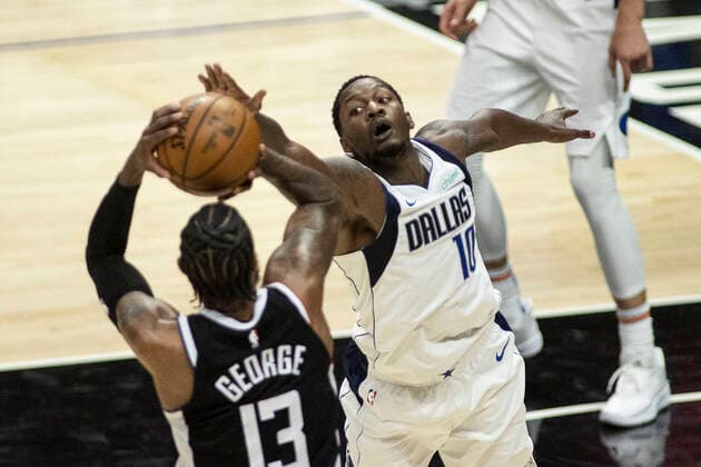 May 22, 2021, Los Angeles, California, USA: Dorian Finney-Smith 10 of the Dallas Mavericks blocks a shot by Paul George 13 of the Los Angeles Clippers during Game One of the Western Conference First Round game on Saturday May 22, 2021 at the Staples Center in Los Angeles, California. Clippers lose to Mavericks, 103-113. PI Los Angeles USA - ZUMAp124 20210522_zaa_p124_033 Copyright: xJAVIERxROJASx