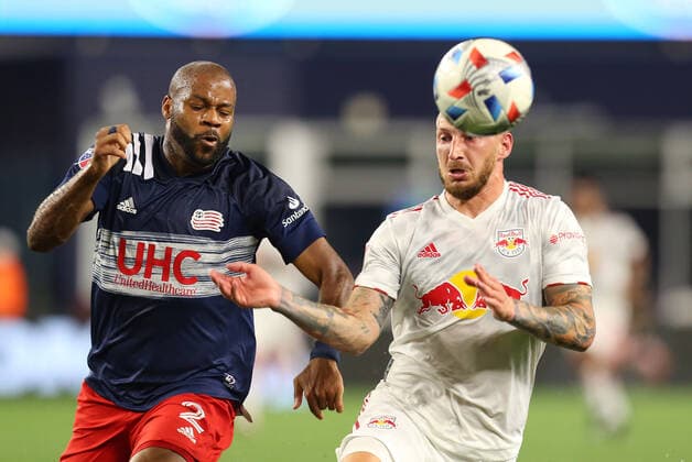 May 22, 2021; Foxborough, MA, USA; New England Revolution defender Andrew Farrell (2) and New York Red Bulls midfielder Daniel Royer (77) in action during an MLS, Fussball Herren, USA match between New York Red Bulls Union and New England Revolution at Gillette Stadium. CSM Foxborough United States - ZUMAc04_ 20210522_zaf_c04_128 Copyright: xAnthonyxNesmithx