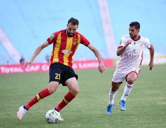 May 22, 2021, Tunis, Tunisia: Esperance player Hamdi Naguez and CR Belouizdad, Zakaria Draoui in action during the African Champions League quarter-final match between Esperance Sportive de Tunis (EST) and CR Belouizdad from Algeria at Rades stadiums. Tunis Tunisia - ZUMAs197 20210522_zaa_s197_227 Copyright: xJdidixWassimx