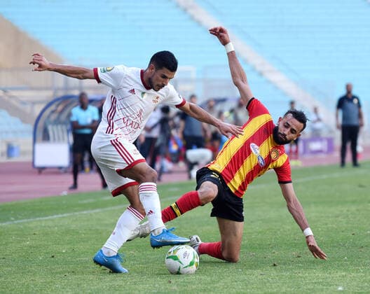 May 22, 2021, Tunis, Tunisia: Esperance player Ghaylen Chaalali and CR Belouizdad, Bilel Tariket in action during the African Champions League quarter-final match between Esperance Sportive de Tunis (EST) and CR Belouizdad from Algeria at Rades stadiums. Tunis Tunisia - ZUMAs197 20210522_zaa_s197_233 Copyright: xJdidixWassimx