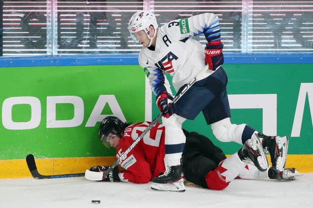 RIGA, LATVIA - MAY 23, 2021: Canada s Owen Power (L) and the USA s Matt Roy fight for the puck in their 2021 IIHF World Championship, WM, Weltmeisterschaft Group B Ice hockey, Eishockey match at Arena Riga. Natalia Fedosenko TASS  TS10114D