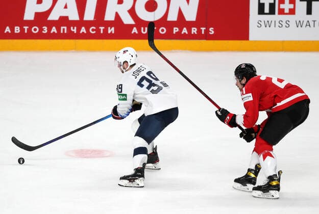 RIGA, LATVIA - MAY 23, 2021: The USA s Zac Jones (L) and Canada s Nick Paul fight for the puck in their 2021 IIHF World Championship, WM, Weltmeisterschaft Group B Ice hockey, Eishockey match at Arena Riga. Natalia Fedosenko TASS  TS10115C