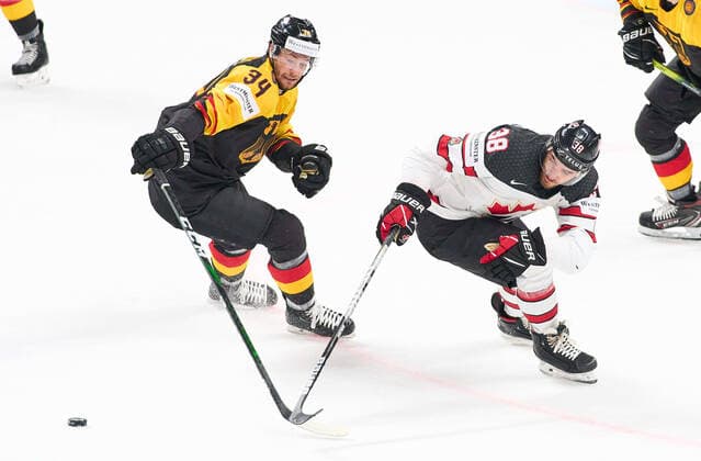Tom KÜHNHACKL 34 of Germany compete, fight for the puck against Mario Ferraro 38 of Canada. GERMANY - CANADA IIHF Ice hockey, Eishockey WORLD CHAMPIONSHIPS Group B in Riga, Latvia, Lettland, May 24, 2021, Season 2020 2021