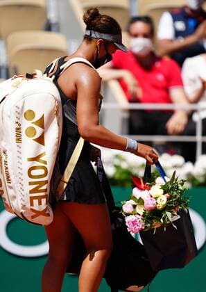 Mandatory Credit: Photo by Javier Garcia BPI Shutterstock (11977037cs) Naomi Osaka walking off with flowers on Mother s Day in France, after victory in her first round match French Open Tennis, Day One, Roland Garros, Paris, France - 30 May 2021 French Open Tennis, Day One, Roland Garros, Paris, France - 30 May 2021  Copyright: xJavierxGarcia BPI Shutterstockx 11977037cs