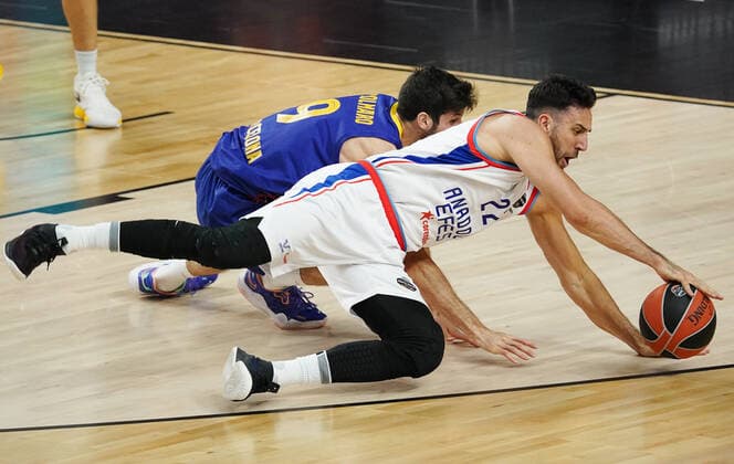 COLOGNE, GERMANY - MAY 30, 2021: Anadolu s Vasilije Micic (front) and Barcelona s Leandro Bolmaro in action in the 2020 21 Euroleague Final Four championship game between FC Barcelona, Barca and Anadolu Efes Istanbul at Lanxess Arena. Tatyana Makeyeva TASS  TS102292