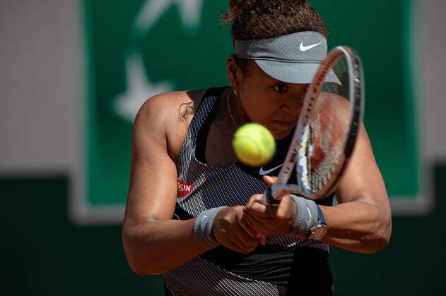 (210531) -- PARIS, May 31, 2021 -- Osaka Naomi of Japan returns the ball during the women s singles first round match against Patricia Maria Tig of Romania at the French Open tennis tournament at Roland Garros in Paris, France, May 30, 2021. (Photo by Xinhua) (SP)FRANCE-PARIS-TENNIS-ROLAND GARROS-FRENCH OPEN-WOMEN S SINGLES AurelienxMorissard 