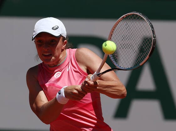 (210531) -- PARIS, May 31, 2021 -- Iga Swiatek of Poland hits a return during the women s singles first round match between Kaja Juvan of Slovenia and Iga Swiatek of Poland at the French Open tennis tournament at Roland Garros in Paris, France, May 31, 2021. ) (SP)FRANCE-PARIS-TENNIS-ROLAND GARROS-FRENCH OPEN-WOMEN S SINGLES GaoxJing 