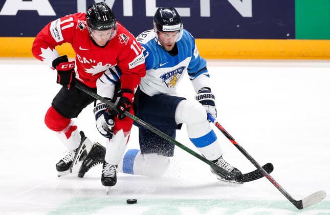 RIGA, LATVIA â€“ JUNE 1, 2021: Canada s Jaret Anderson-Dolan (L) and Finland s Iiro Pakarinen in their 2021 IIHF World Championship, WM, Weltmeisterschaft Group B Ice hockey, Eishockey match at Arena Riga. Natalia Fedosenko TASS  TS102547
