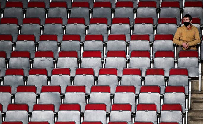 RIGA, LATVIA â€“ JUNE 1, 2021: A spectator attends a 2021 IIHF World Championship, WM, Weltmeisterschaft Group B Ice hockey, Eishockey match between Canada and Finland at Arena Riga. Starting from June 1, those fans who were vaccinated against, or already recovered from, COVID-19 are allowed to attend IIHF World Championship matches in Latvia. Natalia Fedosenko TASS  TS102586