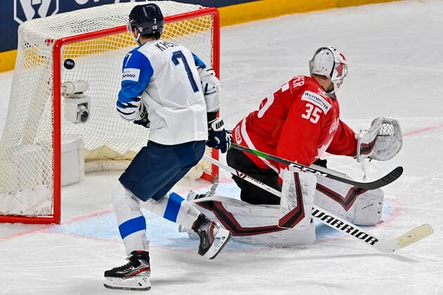 Oliwer Kaski of Finland, left, scores during the 2021 IIHF Ice hockey, Eishockey World Championship, WM, Weltmeisterschaft Group B match Canada vs Finland, played in Riga, Latvia, on June 1, 2021. At right is Canadian goalkeeper Darcy Kuemper. (CTKxPhoto VitxSimanek) CTKPhotoP2021060105131  VIS 004