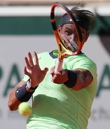 (210602) -- PARIS, June 2, 2021 -- Rafael Nadal of Spain returns the ball during the men s singles first round match between Rafael Nadal of Spain and Alexei Popyrin of Australia at the French Open tennis tournament at Roland Garros in Paris, France, June 1, 2021. ) (SP)FRANCE-PARIS-TENNIS-ROLAND GARROS-FRENCH OPEN-MEN S SINGLES GaoxJing 