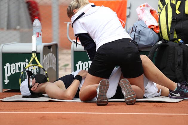 (210603) -- PARIS, June 3, 2021 -- Zheng Saisai of China (bottom) receives medical treatments during the women s singles second round match between Zheng Saisai of China and Marta Kostyuk of Ukraine at the French Open tennis tournament at Roland Garros in Paris, France, June 3, 2021. ) (SP)FRANCE-PARIS-TENNIS-ROLAND GARROS-FRENCH OPEN-WOMEN S SINGLES-DAY 5 GaoxJing 