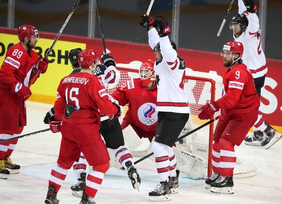 RIGA, LATVIA - JUNE 3, 2021: Canada s players celebrate a goal in a 2021 IIHF World Championship, WM, Weltmeisterschaft quarterfinal Ice hockey, Eishockey match against Russia at the Olympic Sports Center. Due to CAS sanctions, the Russian team performs under the name and flag of the Russian Olympic Committee (ROC). Natalia Fedosenko TASS  TS103356
