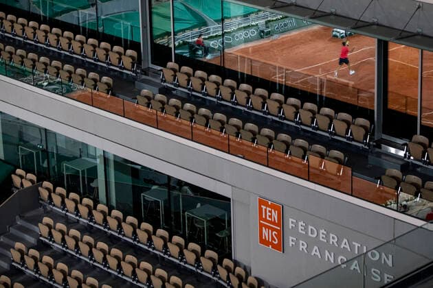 TENNIS - French Open 2021 PARIS,FRANCE,05.June.21 - TENNIS - ATP, Tennis Herren World Tour, French Open, Roland Garros, Grand Slam. Image shows empty seats with a reflection of Roger Federer (SUI).  GEPAxpictures xPatrickxSteiner