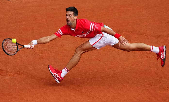 (210606) -- PARIS, June 6, 2021 -- Novak Djokovic returns the ball during the men s singles third round match between Novak Djokovic of Serbia and Ricardas Berankis of Lithuania at the French Open tennis tournament at Roland Garros in Paris, France, June 5, 2021. ) (SP)FRANCE-PARIS-TENNIS-ROLAND GARROS-FRENCH OPEN-MEN S SINGLES GaoxJing 