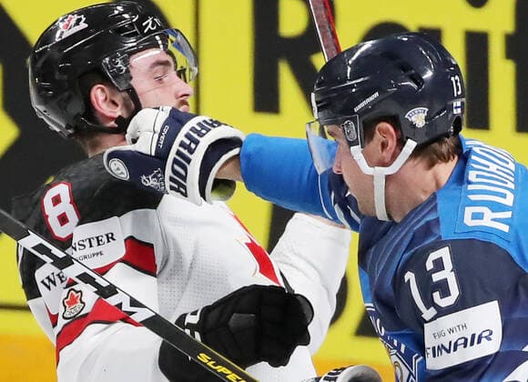 RIGA, LATVIA - JUNE 6, 2021: Canada s Liam Foudy (L) and Finland s Mikael Ruohomaa in their 2021 IIHF World Championship, WM, Weltmeisterschaft Final Ice hockey, Eishockey match at Arena Riga. Natalia Fedosenko TASS  TS103E86