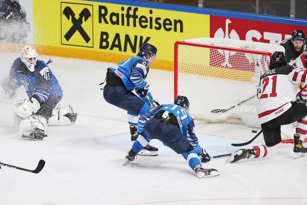 Eishockey, WM, Finale, Kanada ist Weltmeister RIGA, LATVIA - JUNE 6, 2021: Canada s Nick Paul (R front) scores past Finnish goaltender Juho Olkinuora (L) in their 2021 IIHF World Championship, WM, Weltmeisterschaft Final Ice hockey, Eishockey match at Arena Riga; Canada won 3-2 in overtime. Natalia Fedosenko TASS  TS103EA8