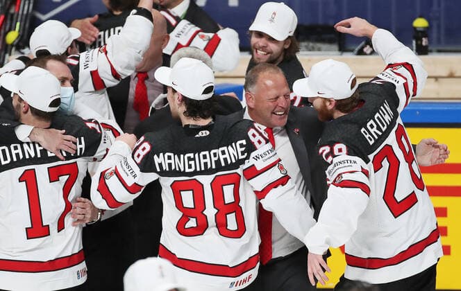 RIGA, LATVIA - JUNE 6, 2021: Canadian players and their head coach Gerard Gallant (2nd R) celebrate victory over Finland in their 2021 IIHF World Championship, WM, Weltmeisterschaft Final Ice hockey, Eishockey match at Arena Riga; Canada won 3-2 in overtime. Natalia Fedosenko TASS  TS103EB7