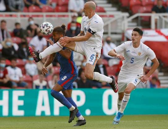 Middlesbrough, England, 6th June 2021. Vlad Chiriches of Romania brings down Dominic Calvert-Lewin of England to give away a penalty during the International Football Friendly match at the Riverside Stadium, Middlesbrough. Picture credit should read: Darren Staples Sportimage EDITORIAL USE ONLY. No use with unauthorised audio, video, data, fixture lists, club league logos or live services. Online in-match use limited to 120 images, no video emulation. No use in betting, games or single club league player publications. SPI-1079-0103
