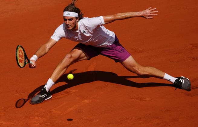 (210607) -- PARIS, June 7, 2021 -- Stefanos Tsitsipas of Greece returns the ball during the men s singles fourth round match between Stefanos Tsitsipas of Greece and Pablo Carreno Busta of Spain at the French Open tennis tournament at Roland Garros in Paris, France, June 6, 2021. ) (SP)FRANCE-PARIS-TENNIS-ROLAND GARROS-FRENCH OPEN-MEN S SINGLES GaoxJing 