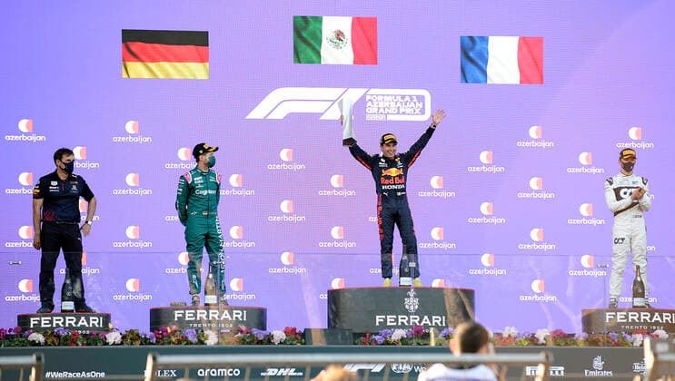 (210607) -- BAKU, June 7, 2021 -- Sergio Perez (2nd R) of Reb Bull, Sebastian Vettel (2nd L) of Aston Martin and Pierre Gasly (1st R) of AlphaTauri pose for photos during the awarding ceremony for the Formula 1 2021 Azerbaijan Grand Prix at Baku City Circuit in Baku, Azerbaijan, June 6, 2021. (Photo by Tofiq Babayev Xinhua) (SP)AZERBAIJAN-BAKU-2021 F1 AZERBAIJAN GRAND PRIX LixMing 