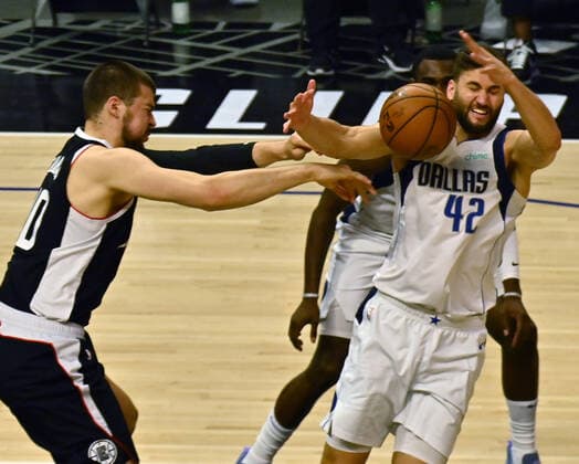 Dallas Mavericks forward Maxi Kleber (42) loses control of the ball under pressure from Los Angeles Clippers center Ivica Zubac (40)) during the first half of Game 7 of their first-round playoff series matchup at Staples Center in Los Angeles on June 6, 2021. The Clippers defeated the Mavericks 126-111. They advance to face the top-seeded Jazz starting Tuesday in Utah.  LAP2021060632 JIMxRUYMEN