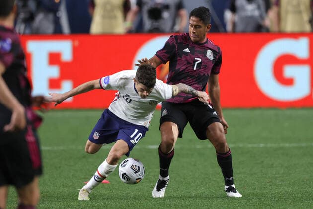 DENVER, CO - JUNE 06: United States forward Christian Pulisic (10) battles with Mexico defender Luis Romo (7) in action during the CONCACAF Nations League finals between Mexico and the United States on June 06, 2021, at Empower Field at Mile High in Denver, CO. (Photo by Robin Alam Icon Sportswire) SOCCER: JUN 06 Concacaf Nations League Final - Mexico v United States Icon164210606016