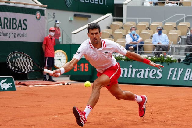 (210608) -- PARIS, June 8, 2021 -- Novak Djokovic of Serbia hits a return during the men s singles fourth round match between Novak Djokovic of Serbia and Lorenzo Musetti of Italy at the French Open tennis tournament at Roland Garros in Paris, France, June 7, 2021. ) (SP)FRANCE-PARIS-TENNIS-ROLAND GARROS-FRENCH OPEN-DAY 9 GaoxJing 