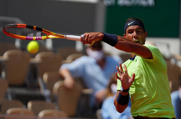 (210610) -- PARIS, June 10, 2021 -- Rafael Nadal of Spain hits a return during the men s singles quarterfinal against Diego Schwartzman of Argentina at the French Open tennis tournament at Roland Garros in Paris, France, June 9, 2021. ) (SP)FRANCE-PARIS-TENNIS-ROLAND GARROS-FRENCH OPEN-MEN S SINGLES-DAY 11 GaoxJing 
