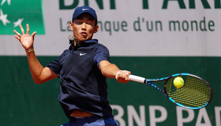 (210610) -- PARIS, June 10, 2021 -- Shang Juncheng of China hits a return during the boys singles third round match against Leo Borg of Sweden at the French Open tennis tournament at Roland Garros in Paris, France, June 9, 2021. ) (SP)FRANCE-PARIS-TENNIS-ROLAND GARROS-FRENCH OPEN-BOY S SINGLES-DAY 11 GaoxJing 