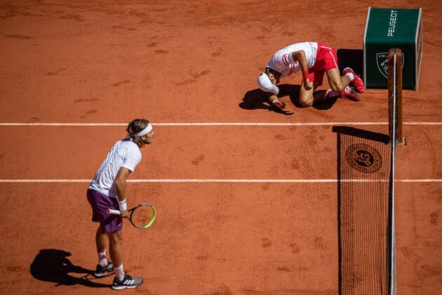 Novak DJOKOVIC of Serbia falls to the ground during his men s single against Stefanos TSITSIPAS of Greece on the Men s Final of the French Open tennis tournament at Roland Garros in Paris, France, 13 June 2021.  Copyright: xAurelienxMorissardx